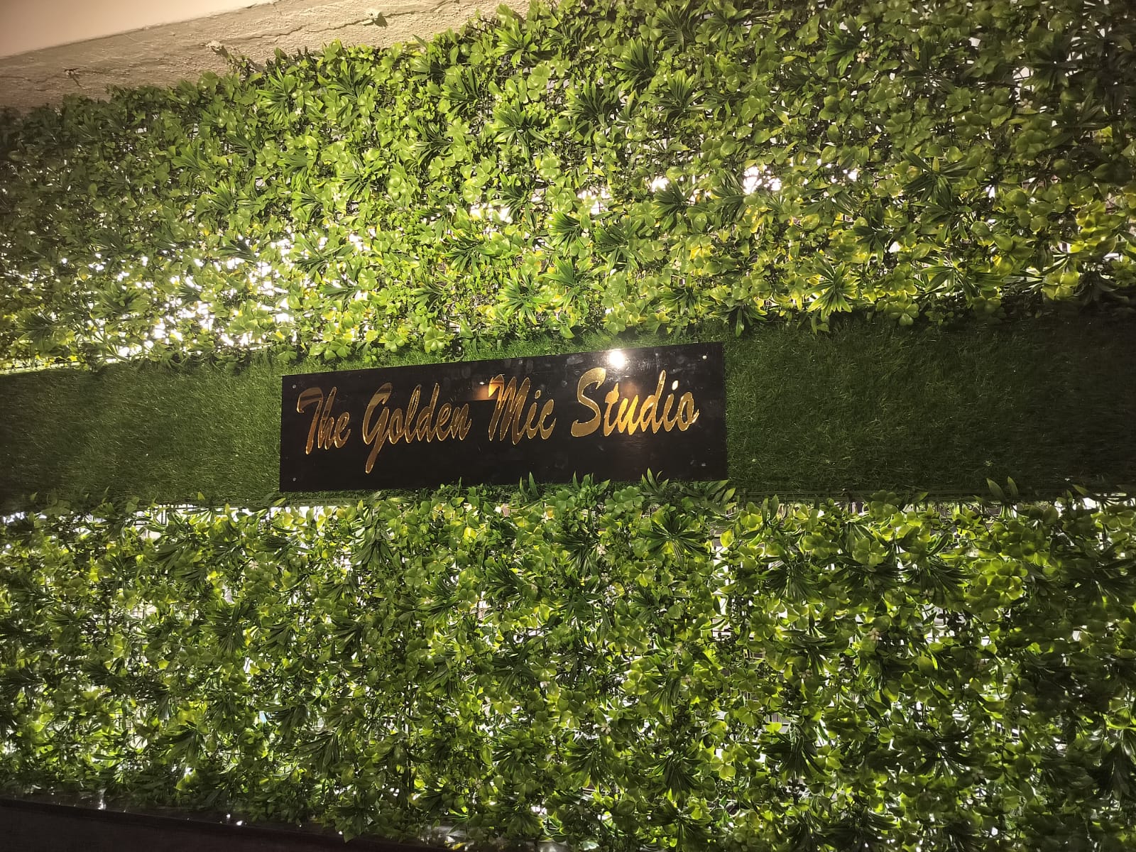 The Golden Mic Studio entrance signage